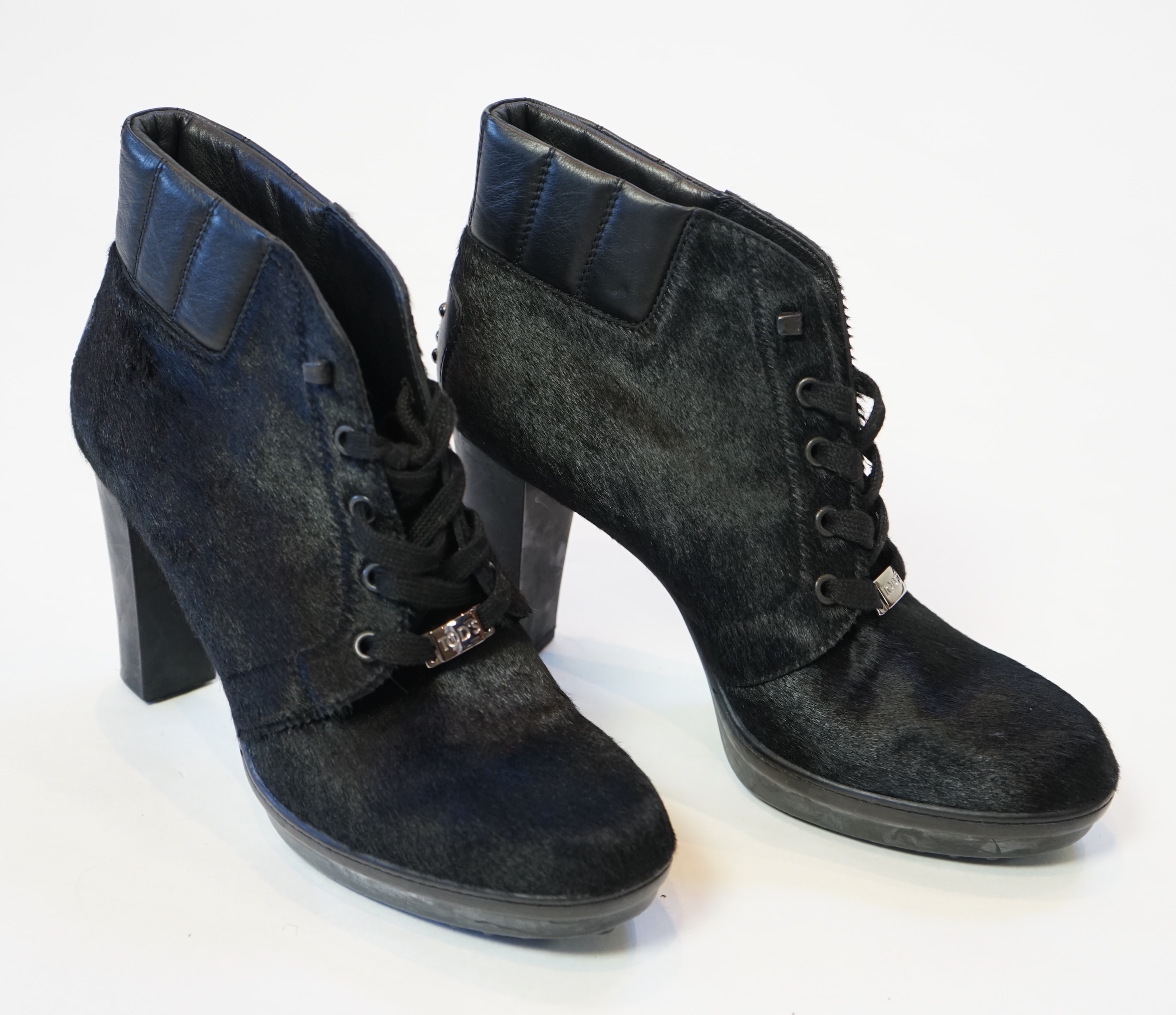 A pair of Tod's black calf hair and leather trim lace up ankle boots, size EU 39